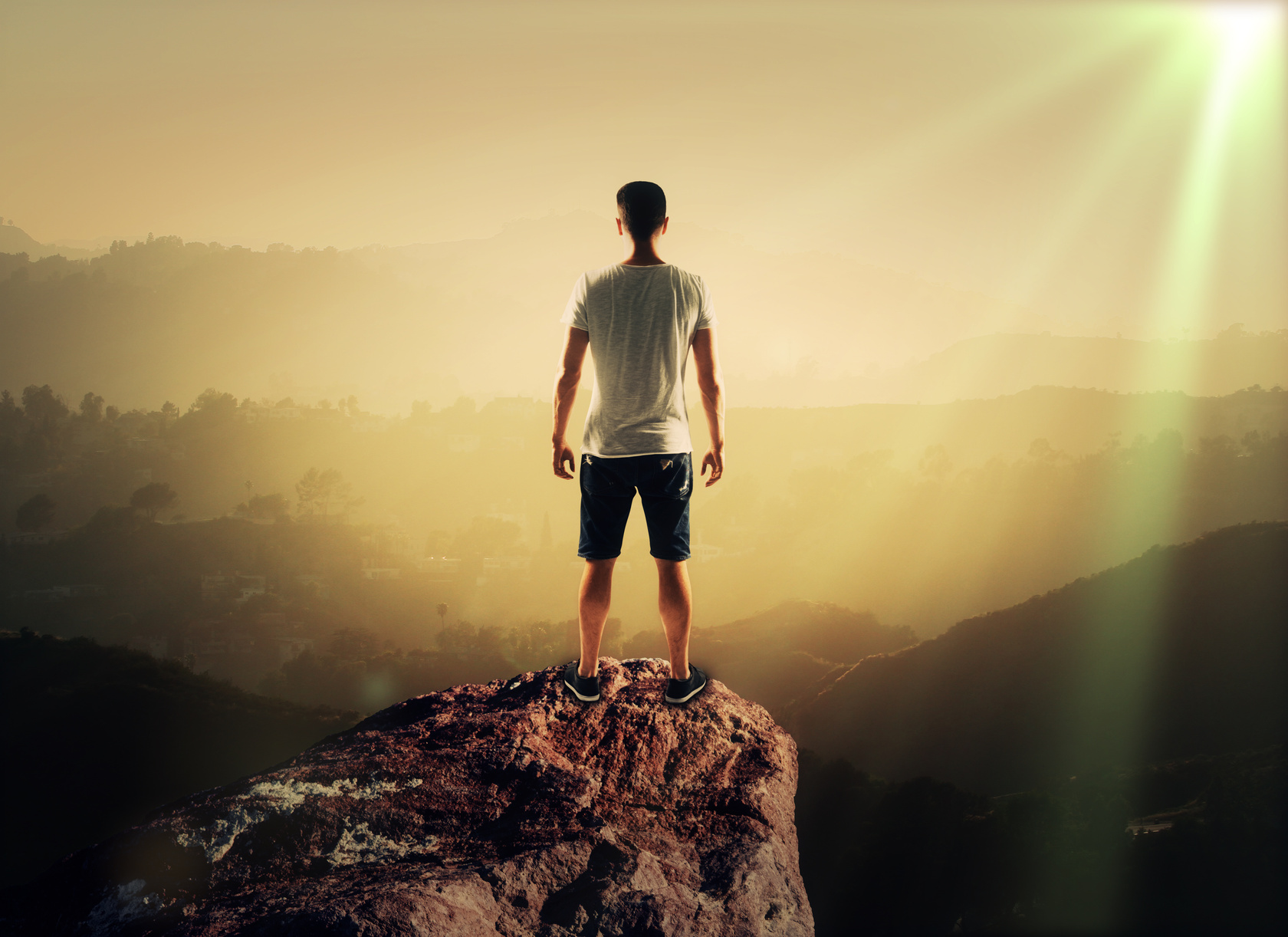 man on top mountain